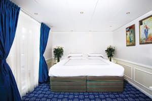 UNIWORLD Boutique River Cruises River Victoria Accommodation Presidential Suite Bedroom.jpg